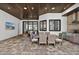 Charming outdoor dining area with a built-in grill, perfect for entertaining guests by the pool at 3800 Carupano Ct, Punta Gorda, FL 33950