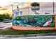 A vibrant outdoor mural depicting local wildlife and aquatic scenes at 3800 Carupano Ct, Punta Gorda, FL 33950