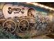 Outdoor mural featuring a covered wagon and musicians under a night sky at 3800 Carupano Ct, Punta Gorda, FL 33950