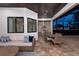 Stylish outdoor space featuring an open air kitchen, seating, and dining area with a stained wood ceiling at 3800 Carupano Ct, Punta Gorda, FL 33950