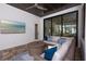 Inviting outdoor patio area, featuring comfortable seating, a ceiling fan, and a seamless transition to indoor living with sliding doors at 3800 Carupano Ct, Punta Gorda, FL 33950