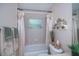 Bathroom featuring a tub with shower, toilet, vanity, and ample storage space at 3824 Dominic St, North Port, FL 34288