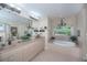 Bright bathroom featuring double vanity, soaking tub under window, and elegant decorative touches throughout at 3824 Dominic St, North Port, FL 34288