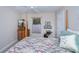 Bedroom featuring a four-poster bed with a decorative quilt, a window with blinds, and furniture at 3824 Dominic St, North Port, FL 34288