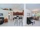 Open concept kitchen features bar seating and a view of the dining and living areas at 3824 Dominic St, North Port, FL 34288