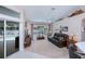 Relaxing living room area with a large sliding door that leads to a screened-in pool at 3824 Dominic St, North Port, FL 34288
