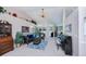 Spacious living area with a piano, sofa, and a view of the pool at 3824 Dominic St, North Port, FL 34288