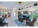 Bright and airy living room with piano, harp, and unique decor at 3824 Dominic St, North Port, FL 34288