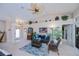 Airy living room featuring high ceilings, unique decorations, and comfortable furniture at 3824 Dominic St, North Port, FL 34288