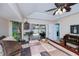 Comfortable main bedroom boasts a ceiling fan and access to the pool area at 3824 Dominic St, North Port, FL 34288