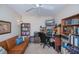 Functional office space with bookshelves, a desk, and a comfortable sofa at 3824 Dominic St, North Port, FL 34288