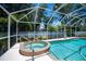Beautiful pool and spa area enclosed with clear screened in enclosure at 3824 Dominic St, North Port, FL 34288