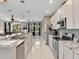 Modern kitchen featuring stainless steel appliances and lots of granite countertop space at 4180 Lenox Blvd, Venice, FL 34293