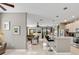 Bright, open kitchen with stainless steel appliances, a kitchen island, and pendant lighting at 4180 Lenox Blvd, Venice, FL 34293