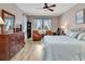 Spacious main bedroom features light hardwood flooring and natural light from the windows at 4180 Lenox Blvd, Venice, FL 34293