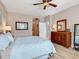 Comfortable main bedroom featuring hardwood floors and open access to hallway at 4180 Lenox Blvd, Venice, FL 34293