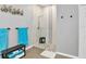 Modern glass shower features neutral tile and black fixtures at 4180 Lenox Blvd, Venice, FL 34293