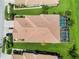 Aerial shot of the roof and backyard of a home with a screened pool at 4567 Whispering Oaks Dr, North Port, FL 34287