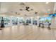 Inside the fitness center with free weights and floor-to-ceiling windows at 4567 Whispering Oaks Dr, North Port, FL 34287