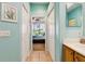 Hallway view into the main bedroom with ensuite bathroom at 4567 Whispering Oaks Dr, North Port, FL 34287