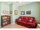 Bright home office with comfortable seating and built in bookcases at 4567 Whispering Oaks Dr, North Port, FL 34287