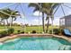 Sparkling pool with a screened enclosure and views of a golf course at 4567 Whispering Oaks Dr, North Port, FL 34287