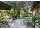 Outdoor patio area featuring greenery and chairs at 5052 Kingsley Rd, North Port, FL 34287