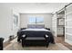 Bedroom with a large sliding door, hardwood floors, and comfortable seating area that create a relaxing atmosphere at 5052 Kingsley Rd, North Port, FL 34287
