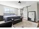 Bedroom with a large sliding door, hardwood floors, and comfortable seating area that create a relaxing atmosphere at 5052 Kingsley Rd, North Port, FL 34287