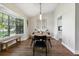 Well-lit dining room with wood floors and natural light at 5052 Kingsley Rd, North Port, FL 34287
