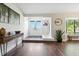 Inviting foyer featuring hardwood floors, a modern console table, and ample natural light at 5052 Kingsley Rd, North Port, FL 34287