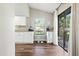 Bright breakfast nook with white cabinets and a sliding glass door to the backyard at 5052 Kingsley Rd, North Port, FL 34287