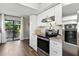 Modern kitchen with stainless steel appliances and a sliding glass door to the patio at 5052 Kingsley Rd, North Port, FL 34287