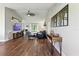 Spacious living room featuring hardwood floors, modern decor, and plenty of natural light at 5052 Kingsley Rd, North Port, FL 34287