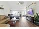 Bright and spacious living room with hardwood floors and a large window at 5052 Kingsley Rd, North Port, FL 34287