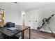 Office space featuring a printer, laptop, and inversion table at 5052 Kingsley Rd, North Port, FL 34287