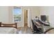 Cozy bedroom with a desk, comfortable bed, and ample natural light from the window at 5146 Northridge Rd # 305, Sarasota, FL 34238