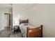 Serene bedroom featuring a comfortable bed, bedside table, and inviting atmosphere at 5146 Northridge Rd # 305, Sarasota, FL 34238