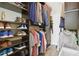 Organized walk-in closet with shelving, hanging rods, and drawers for optimal storage of clothes, shoes, and accessories at 5146 Northridge Rd # 305, Sarasota, FL 34238
