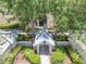 Aerial view of condo entrance with lush trees and accessible parking at 5146 Northridge Rd # 305, Sarasota, FL 34238