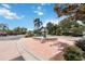 Scenic view of community fountain featuring a tiered design, brick paving, and beautifully landscaped surroundings at 5146 Northridge Rd # 305, Sarasota, FL 34238