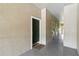 Apartment hallway showcasing door 305, neutral walls, and an indoor entrance at 5146 Northridge Rd # 305, Sarasota, FL 34238