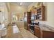 A kitchen featuring granite countertops, stainless steel appliances, and tile flooring at 5146 Northridge Rd # 305, Sarasota, FL 34238