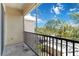 Private screened lanai with views of lush landscaping and beautiful blue skies at 5146 Northridge Rd # 305, Sarasota, FL 34238