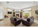 Inviting living room featuring cozy seating arrangements, decorative shelving, and large windows for natural light at 5146 Northridge Rd # 305, Sarasota, FL 34238