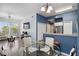 Bright living room boasts natural light, a cozy seating area, and open flow to dining area with a glass table at 5146 Northridge Rd # 305, Sarasota, FL 34238