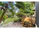 Charming backyard with a wood patio and a view of a pond fountain at 5230 Lake Arrowhead Trl # 29, Sarasota, FL 34231