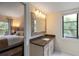 Bathroom with granite counter, tiled mirror frame and ensuite bedroom at 5230 Lake Arrowhead Trl # 29, Sarasota, FL 34231