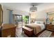Bedroom featuring deck access and wood floors at 5230 Lake Arrowhead Trl # 29, Sarasota, FL 34231