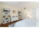 Bedroom featuring hardwood floors, white shelving, and ample closet space at 5230 Lake Arrowhead Trl # 29, Sarasota, FL 34231